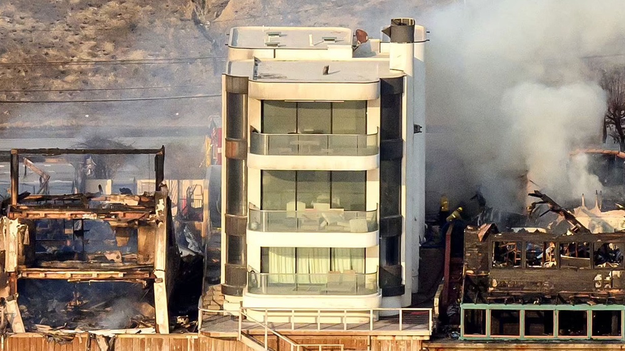 The apartment remained intact despite the houses next door being reduced to rubble.