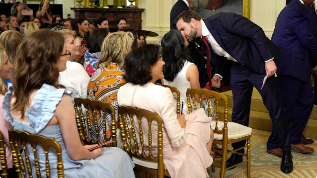 Vice President JD Vance is pictured kissing his wife, second lady Usha Vance, on Thursday as President Trump and first lady Melania Trump celebrated military mothers in the East Room of the White House.