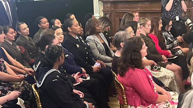 An array of military moms and other special guests are shown at the White House in the East Room on Thursday, May 8.